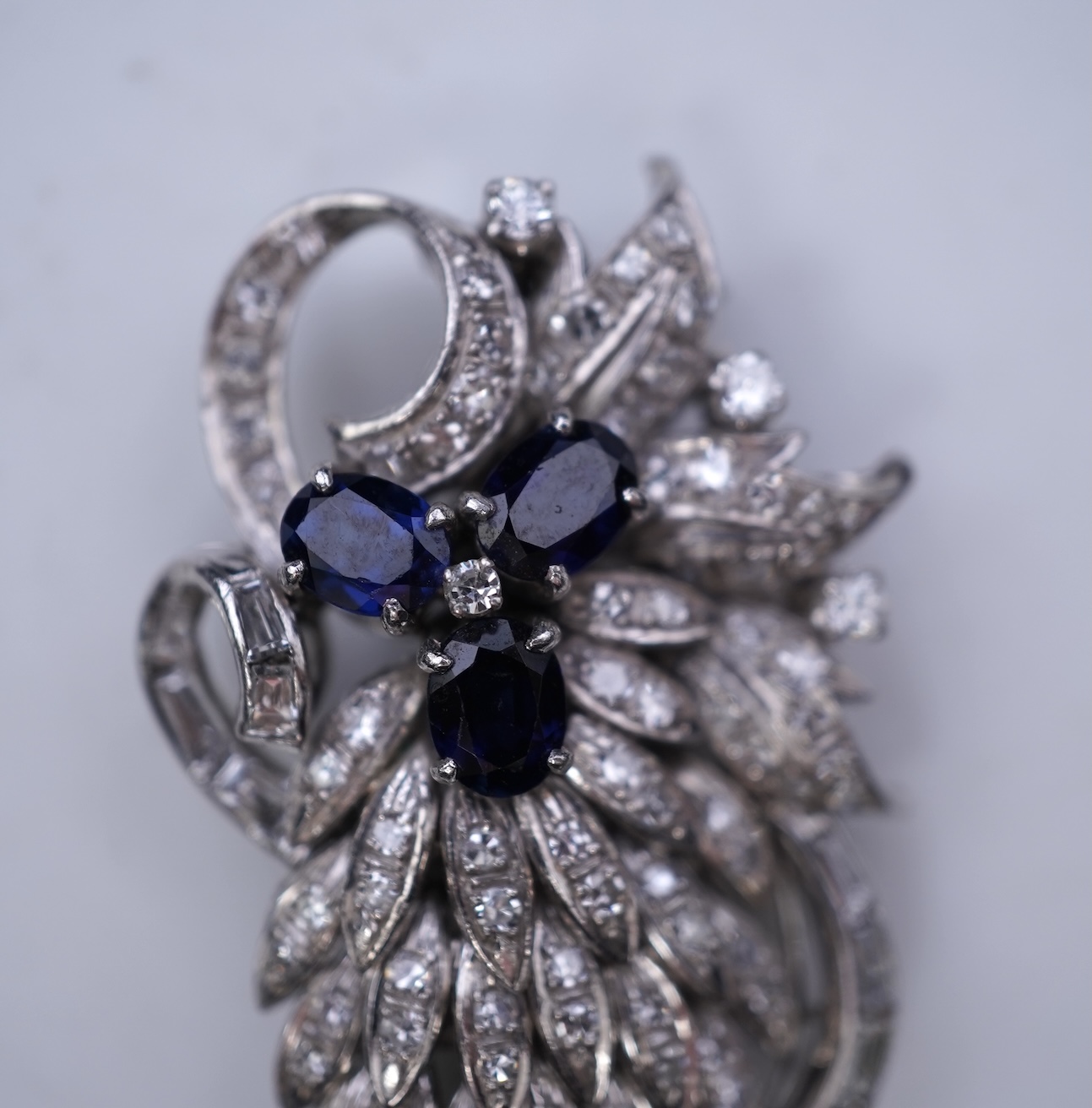 A sapphire and diamond brooch, mid 20th century